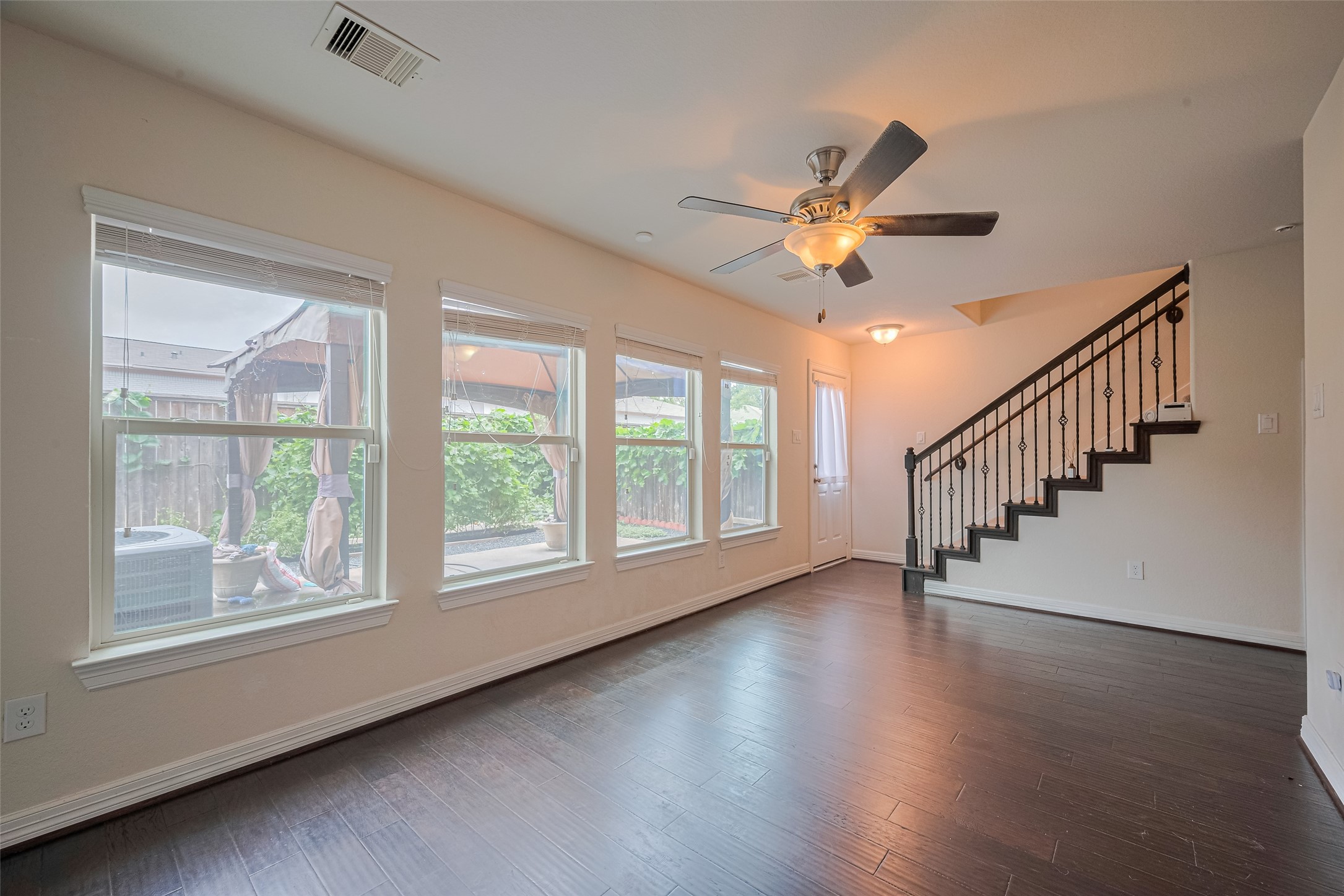 10004 Spring Shadows Park Circle Houston, TX 77080 - Photo 5 of 50 a view of empty room with wooden floor and fan