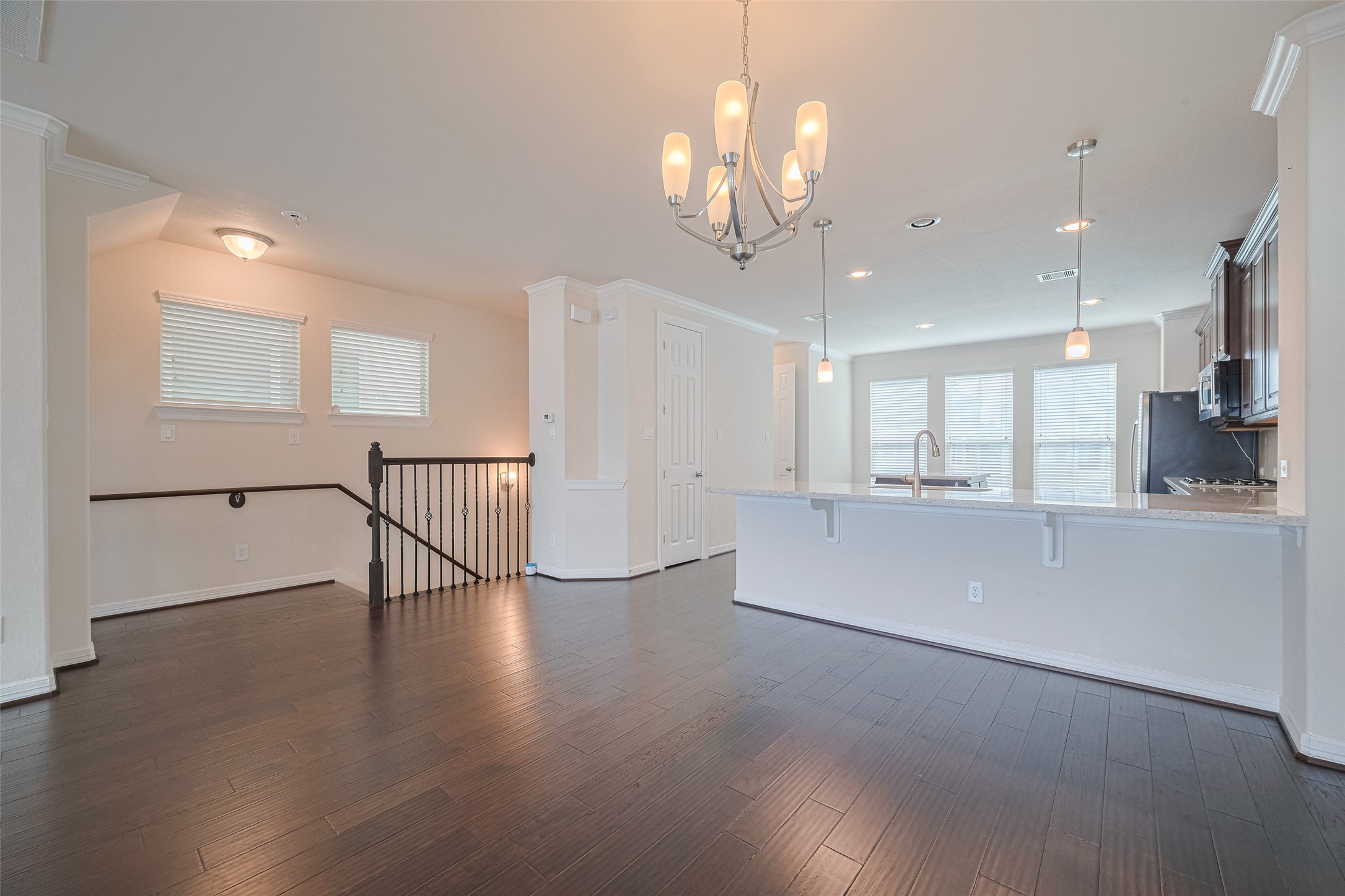 10004 Spring Shadows Park Circle Houston, TX 77080 - Photo 9 of 50 an empty room with wooden floor and windows