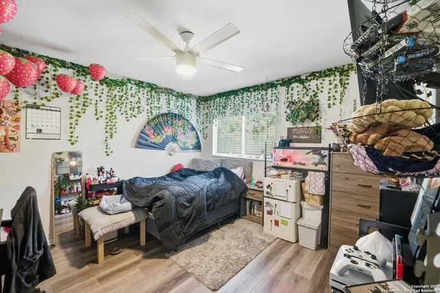 a bedroom with furniture and a chandelier