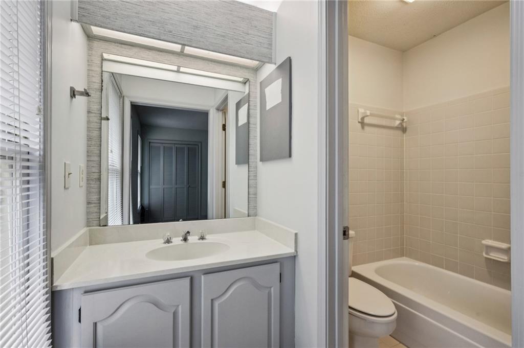 1103 Morningside Place Northeast Atlanta, GA 30306 - Photo 14 of 16 a bathroom with a sink a toilet and shower