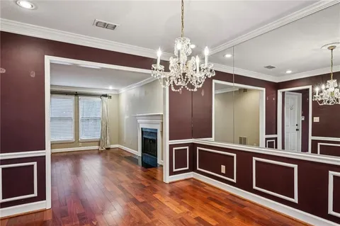 a view of a kitchen with stainless steel appliances granite countertop a refrigerator and a stove top oven
