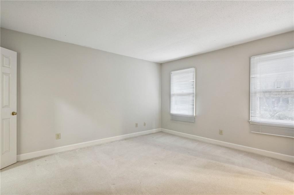 1103 Morningside Place Northeast Atlanta, GA 30306 - Photo 9 of 16 an empty room with windows