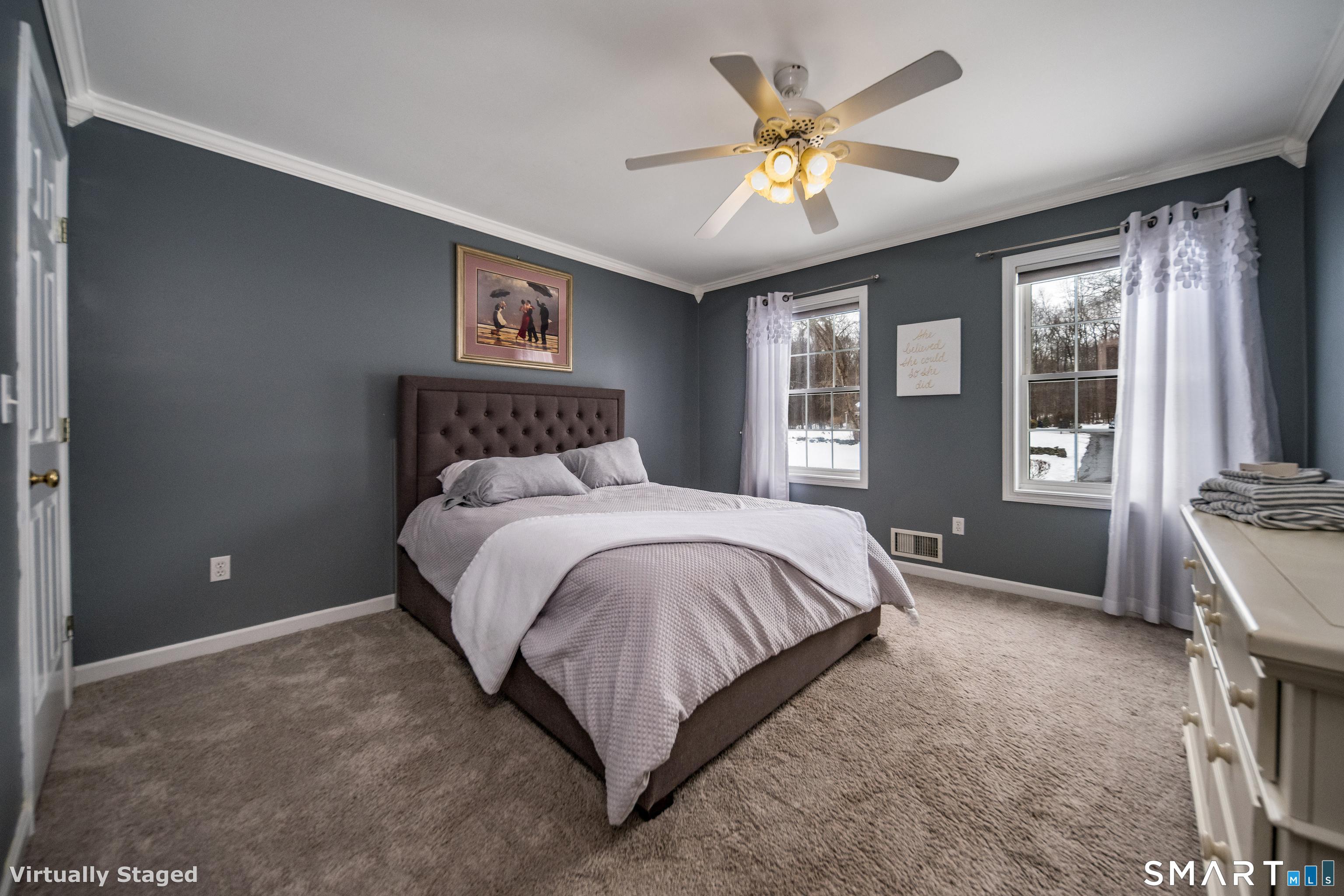 10 Stonewall Lane Clinton, CT 06413 - Photo 13 of 28 a spacious bedroom with a bed and a large window