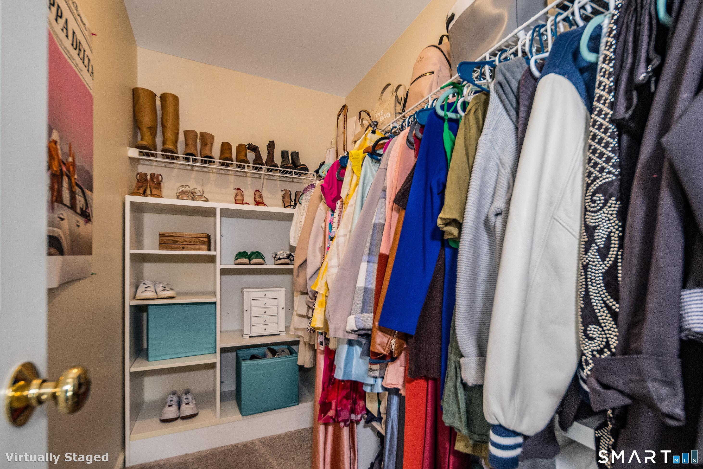 10 Stonewall Lane Clinton, CT 06413 - Photo 15 of 28 a view of walk in closet with clothes and shoes