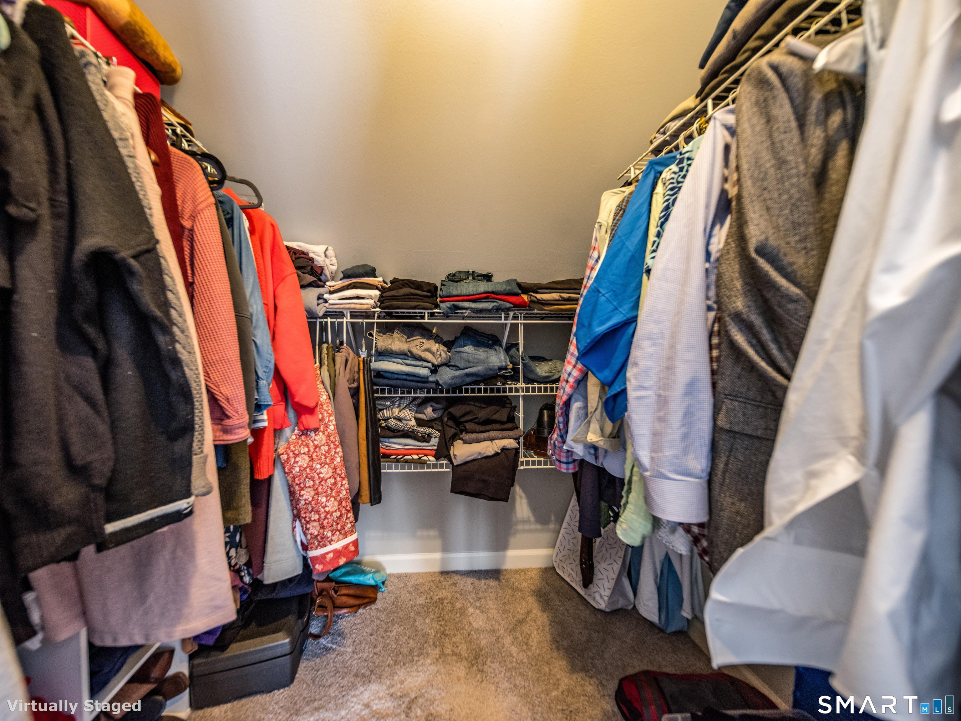 10 Stonewall Lane Clinton, CT 06413 - Photo 17 of 28 a view of walk in closet with clothes and shoes