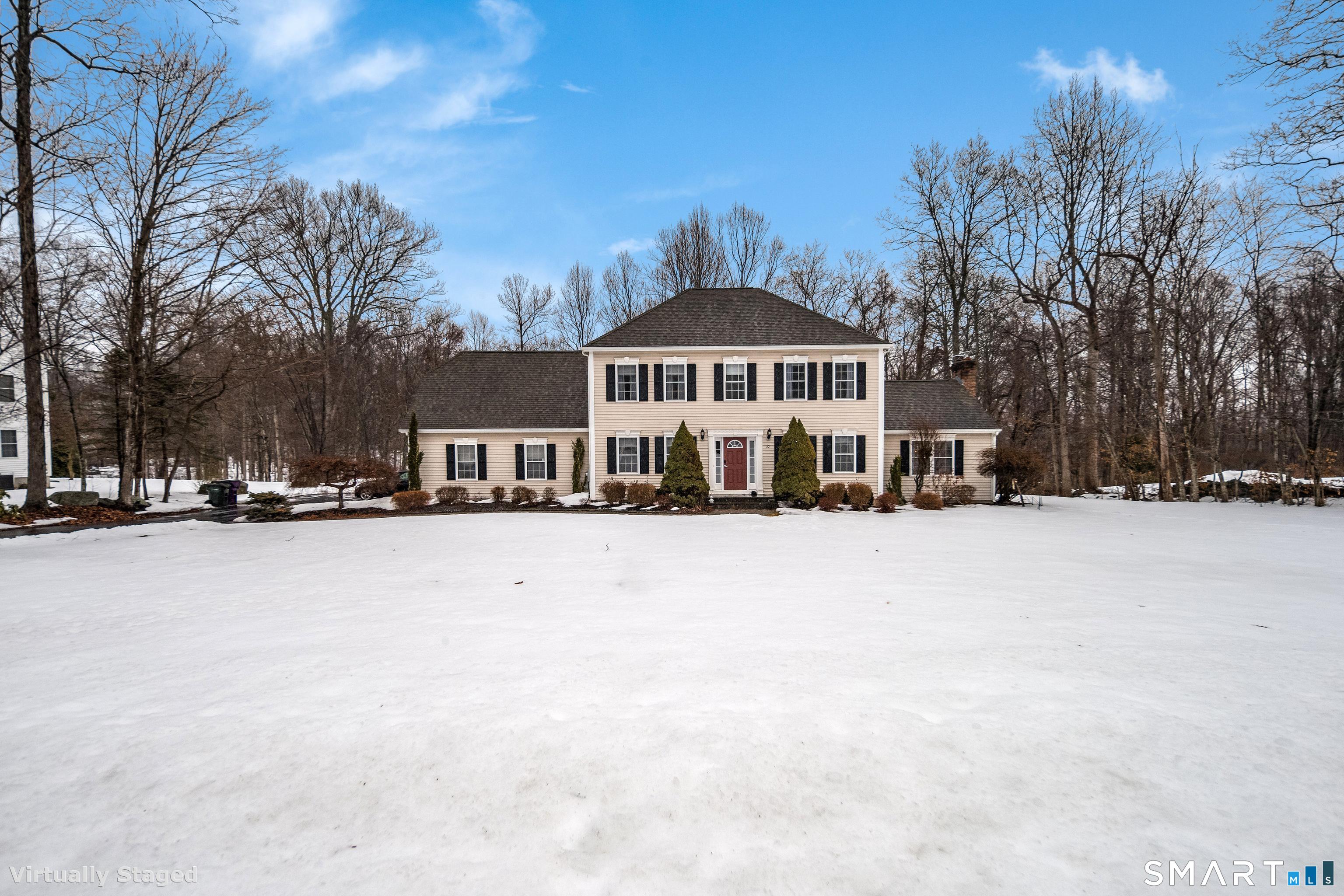 10 Stonewall Lane Clinton, CT 06413 - Photo 2 of 28 a front view of a house with a yard covered in snow
