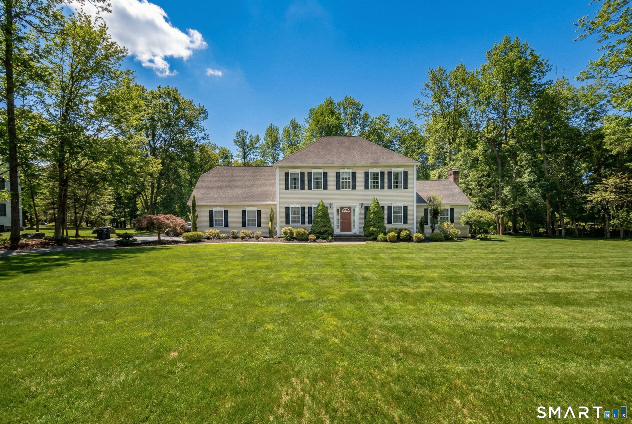 10 Stonewall Lane Clinton, CT 06413 - Photo 28 of 28 a front view of a house with a garden