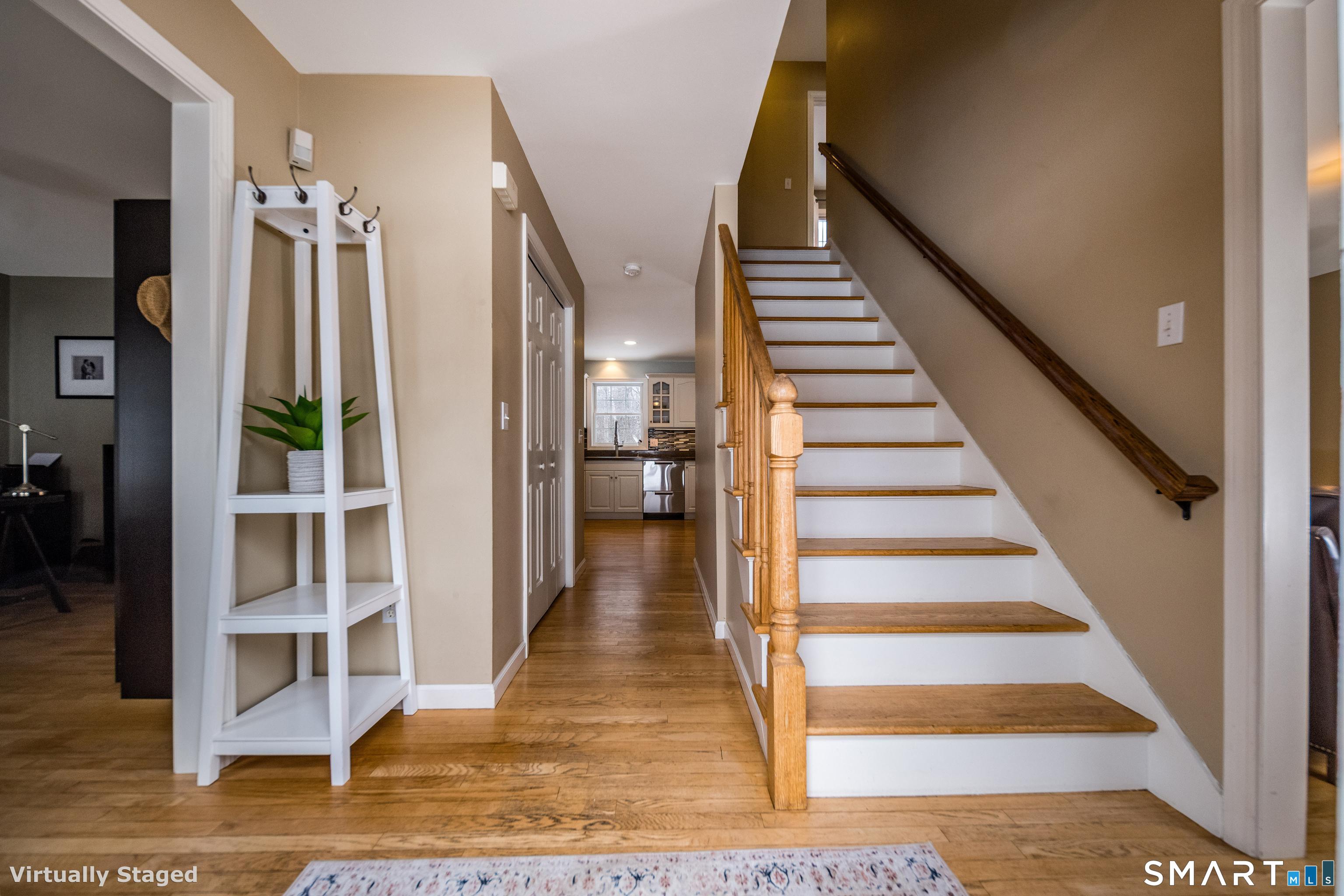 10 Stonewall Lane Clinton, CT 06413 - Photo 4 of 28 a view of entryway and hall with wooden floor
