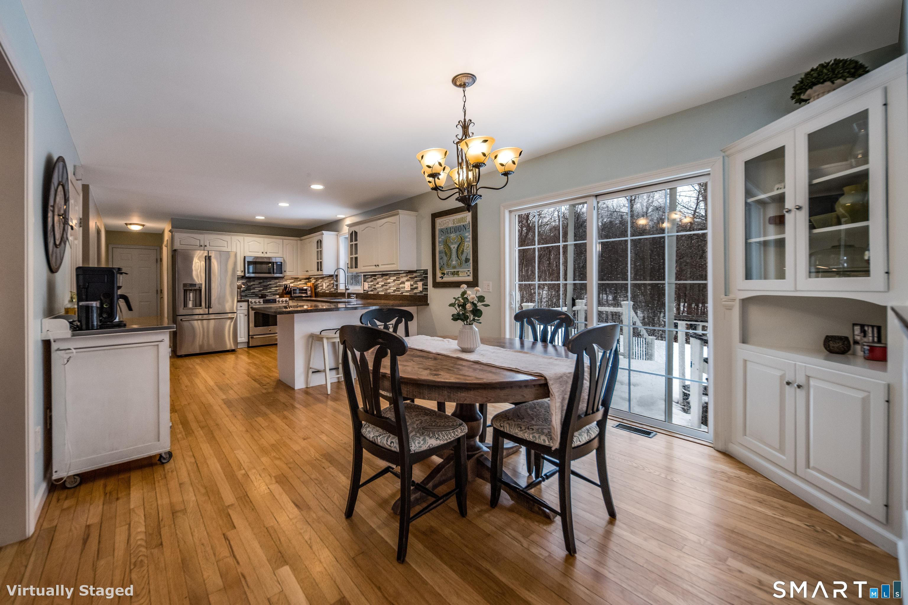 10 Stonewall Lane Clinton, CT 06413 - Photo 7 of 28 a view of a dining room with furniture window and wooden floor