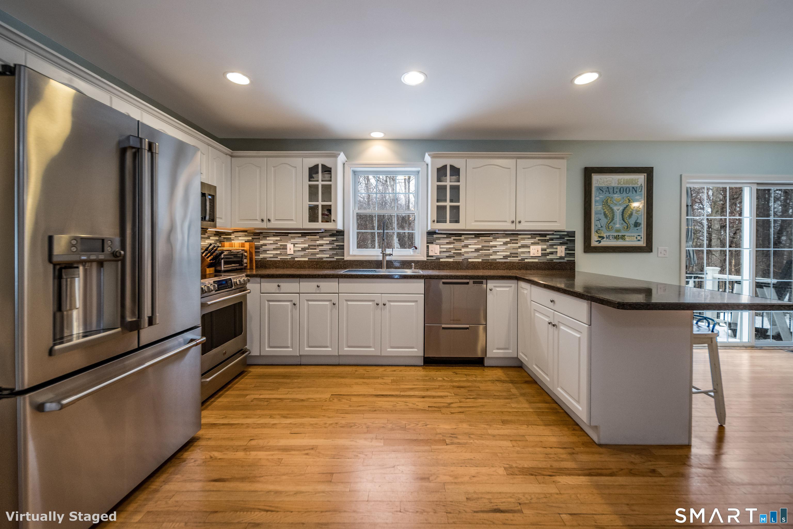 10 Stonewall Lane Clinton, CT 06413 - Photo 8 of 28 a kitchen with stainless steel appliances granite countertop a sink and cabinets