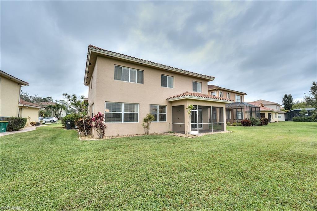 1970 Par Drive Naples, FL 34120 - Photo 21 of 26 a view of a house with a yard and sitting area