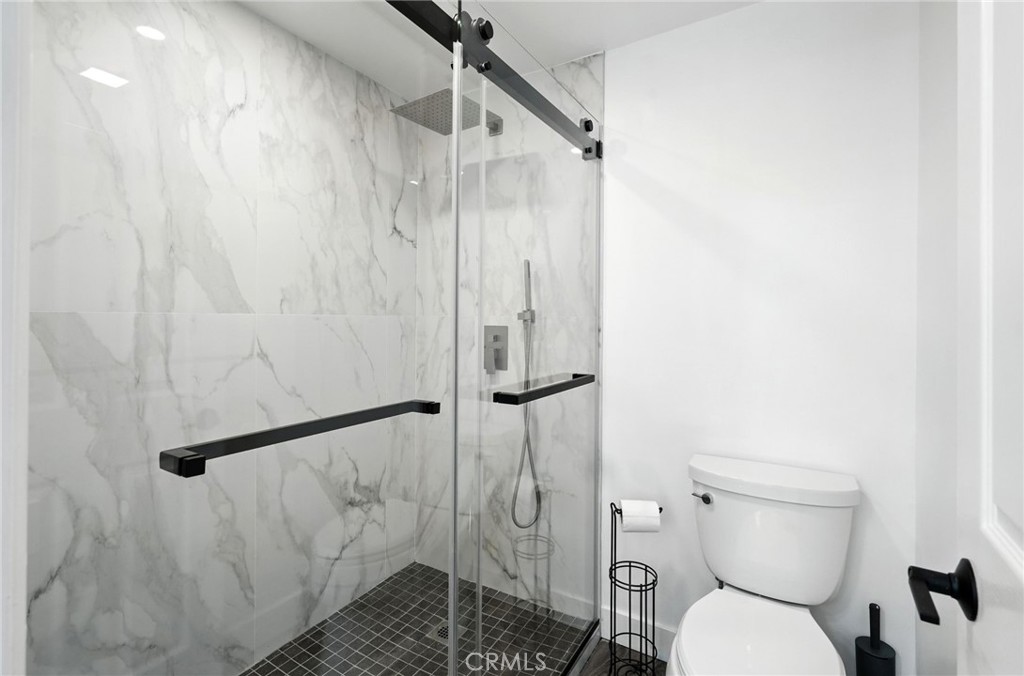 4141 Coldstream Terrace Tarzana, CA 91356 - Photo 16 of 41 a bathroom with a toilet and a shower