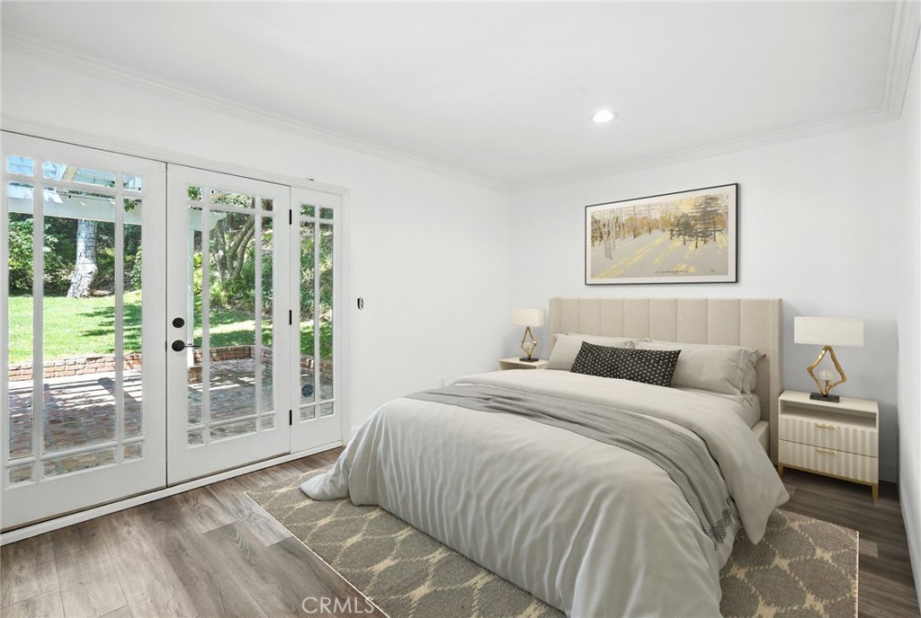 4141 Coldstream Terrace Tarzana, CA 91356 - Photo 17 of 41 a bedroom with a large bed and a large window