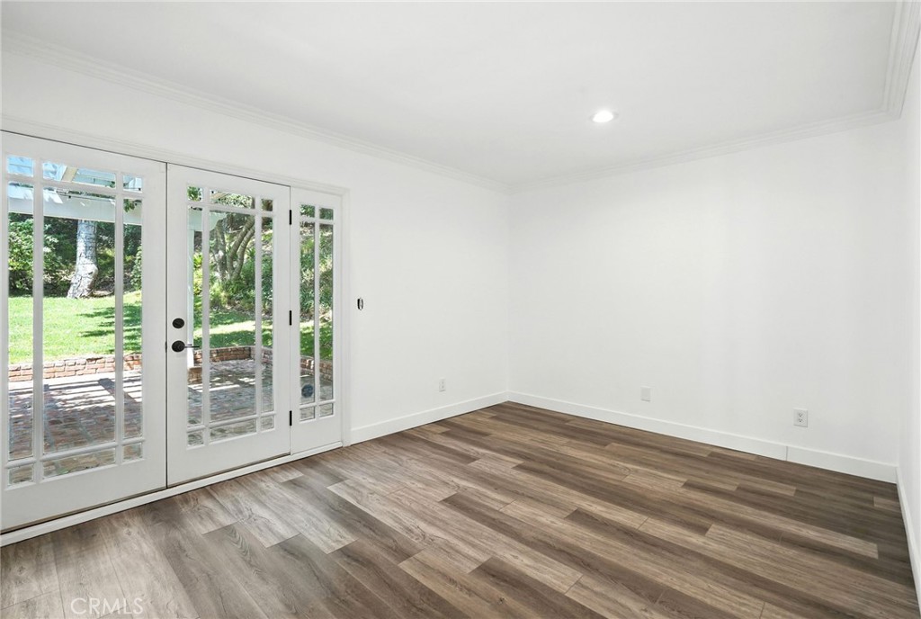 4141 Coldstream Terrace Tarzana, CA 91356 - Photo 18 of 41 a view of empty room with wooden floor and fan