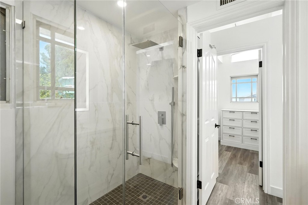 4141 Coldstream Terrace Tarzana, CA 91356 - Photo 23 of 41 a view of a bathroom with a glass shower door