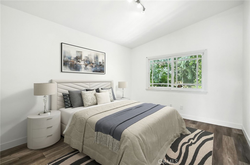 4141 Coldstream Terrace Tarzana, CA 91356 - Photo 25 of 41 a bedroom with a bed and a painting on the wall