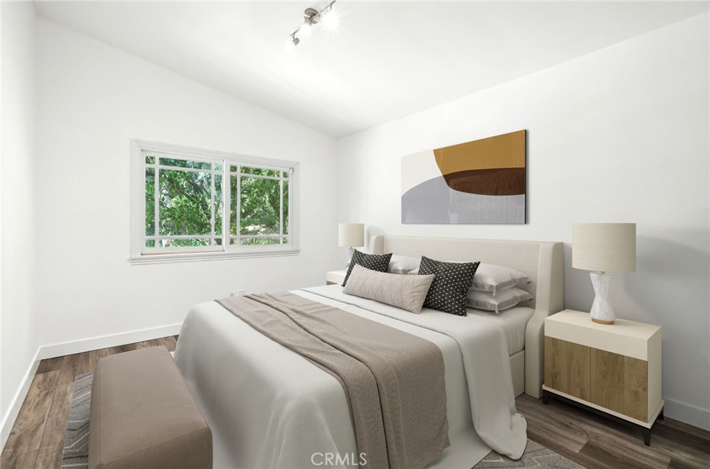 4141 Coldstream Terrace Tarzana, CA 91356 - Photo 27 of 41 a bedroom with a bed and a window