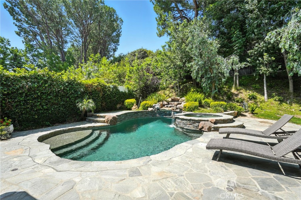 4141 Coldstream Terrace Tarzana, CA 91356 - Photo 30 of 41 a view of a swimming pool with a yard