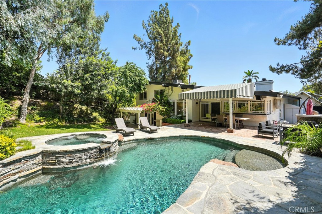 4141 Coldstream Terrace Tarzana, CA 91356 - Photo 31 of 41 a view of a house with swimming pool and sitting area