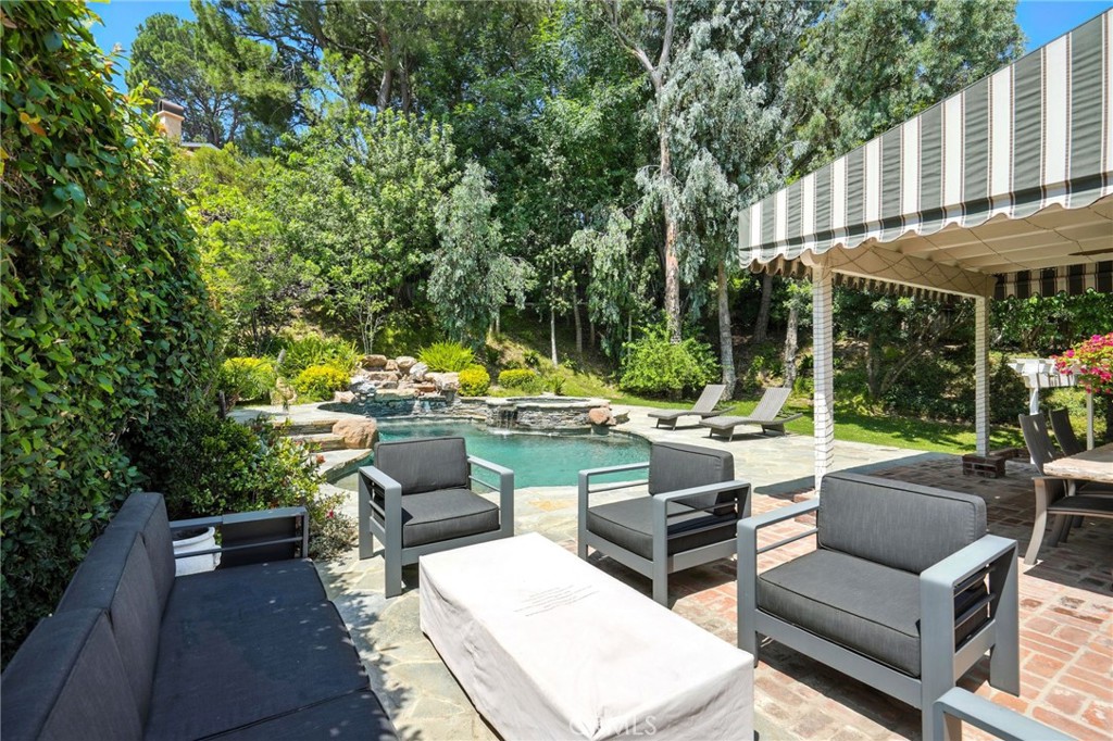 4141 Coldstream Terrace Tarzana, CA 91356 - Photo 35 of 41 a view of a patio with couches table and chairs and potted plants