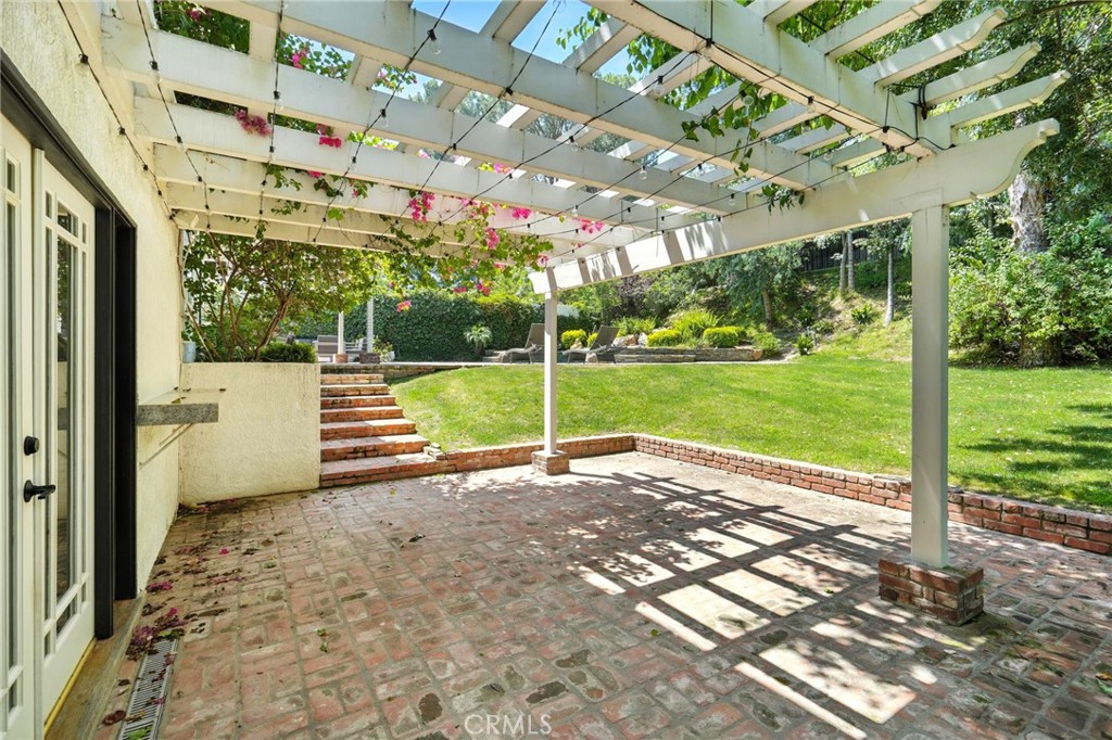 4141 Coldstream Terrace Tarzana, CA 91356 - Photo 36 of 41 a view of a house with a yard