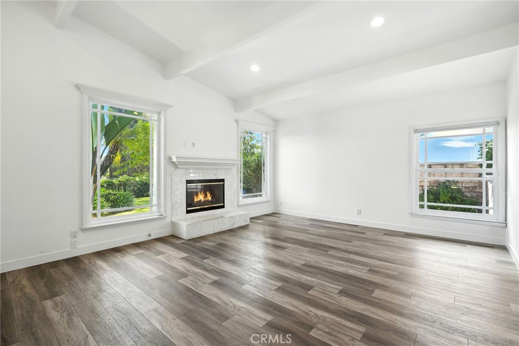 4141 Coldstream Terrace Tarzana, CA 91356 - Photo 5 of 41 a view of an empty room with wooden floor and a window