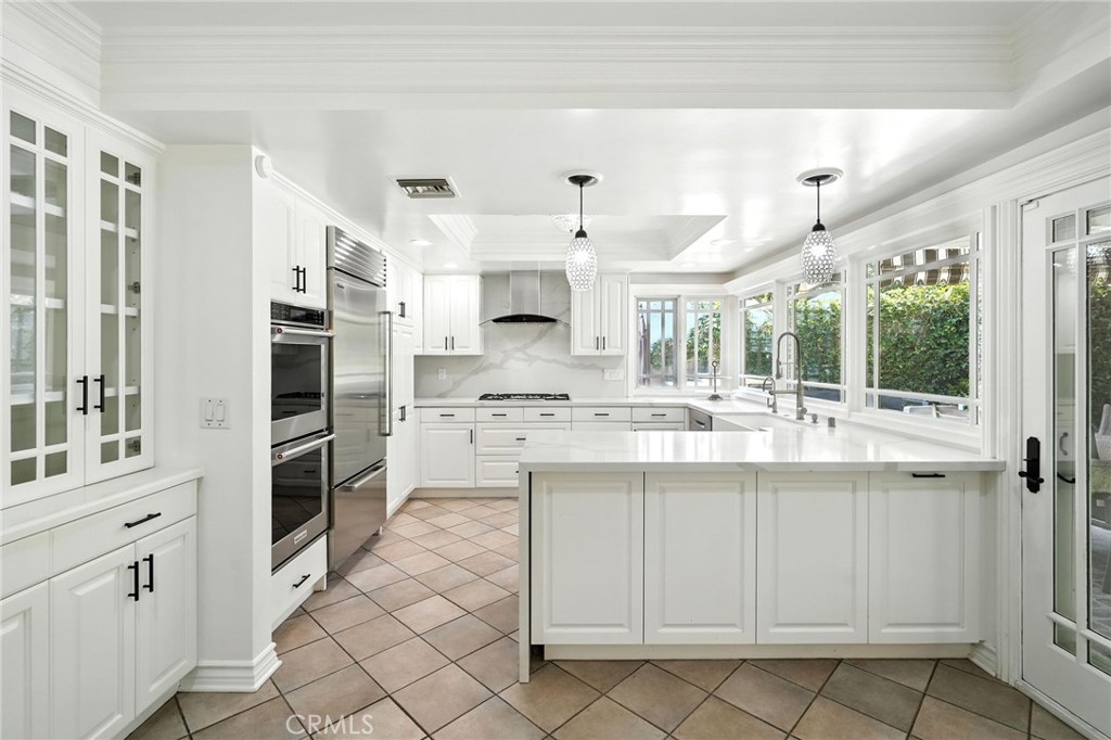 4141 Coldstream Terrace Tarzana, CA 91356 - Photo 10 of 41 a kitchen with cabinets and window