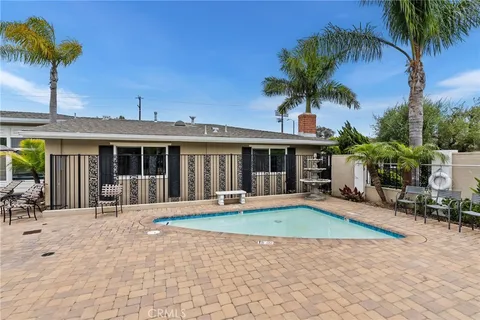 a front view of house with yard and outdoor seating