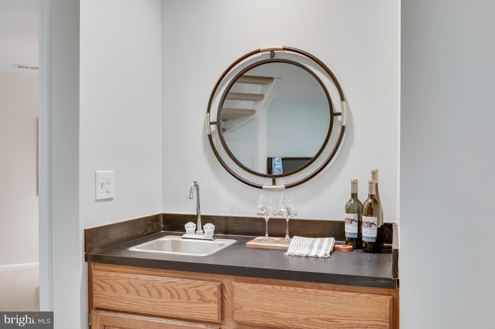 11964 Sentinel Point Court Reston, VA 20191 - Photo 51 of 68 The wet bar is a great spot for easy refreshments!