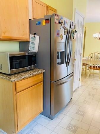 499 Beaman Road Warren, MA 01083 - Photo 12 of 40 a white refrigerator freezer and a stove sitting inside of a kitchen
