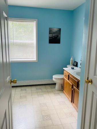 499 Beaman Road Warren, MA 01083 - Photo 16 of 40 a bathroom with a toilet sink and vanity