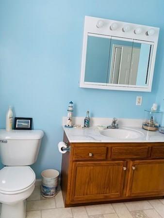 499 Beaman Road Warren, MA 01083 - Photo 17 of 40 a bathroom with a toilet sink and mirror