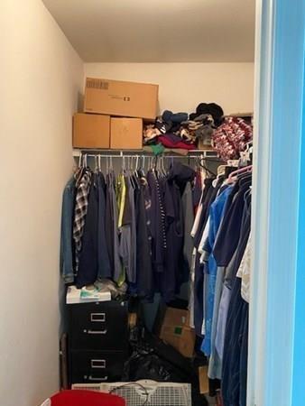 499 Beaman Road Warren, MA 01083 - Photo 19 of 40 a view of walk in closet with clothes and shoes