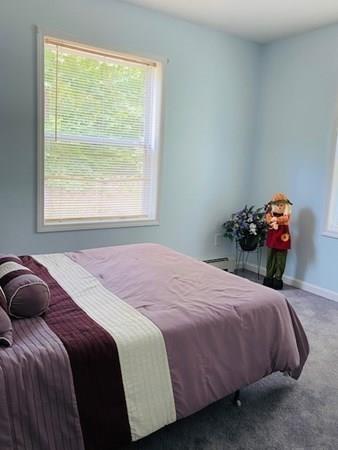 499 Beaman Road Warren, MA 01083 - Photo 20 of 40 a bedroom with a bed and a window