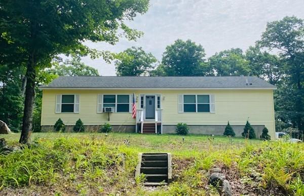 499 Beaman Road Warren, MA 01083 - Photo 2 of 40 a view of a house with backyard sitting area and garden