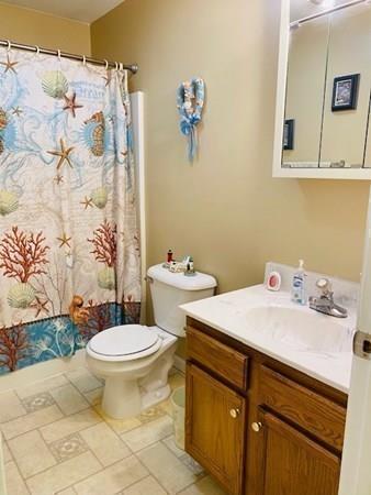 499 Beaman Road Warren, MA 01083 - Photo 23 of 40 a bathroom with a sink toilet and a mirror