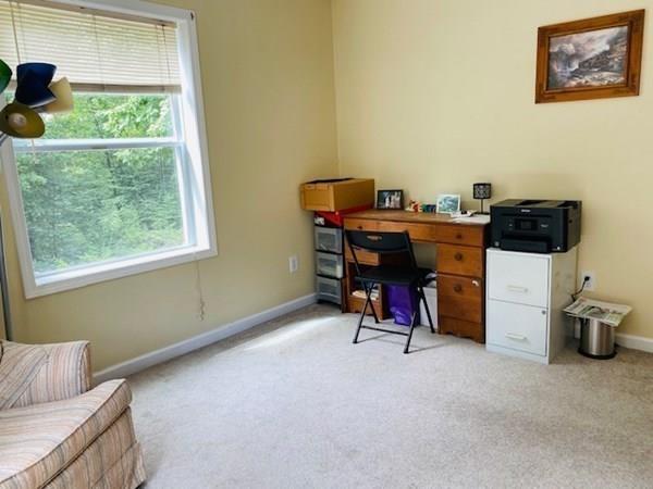 499 Beaman Road Warren, MA 01083 - Photo 24 of 40 a view of a workspace with furniture and a window