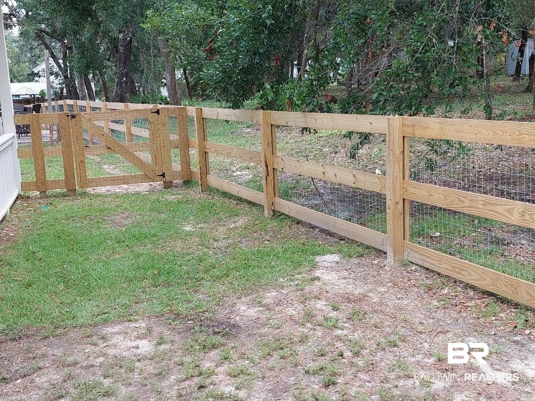 5424 Greentree Road Orange Beach, AL 36561 - Photo 32 of 33 New Fencing around the perimeter of property