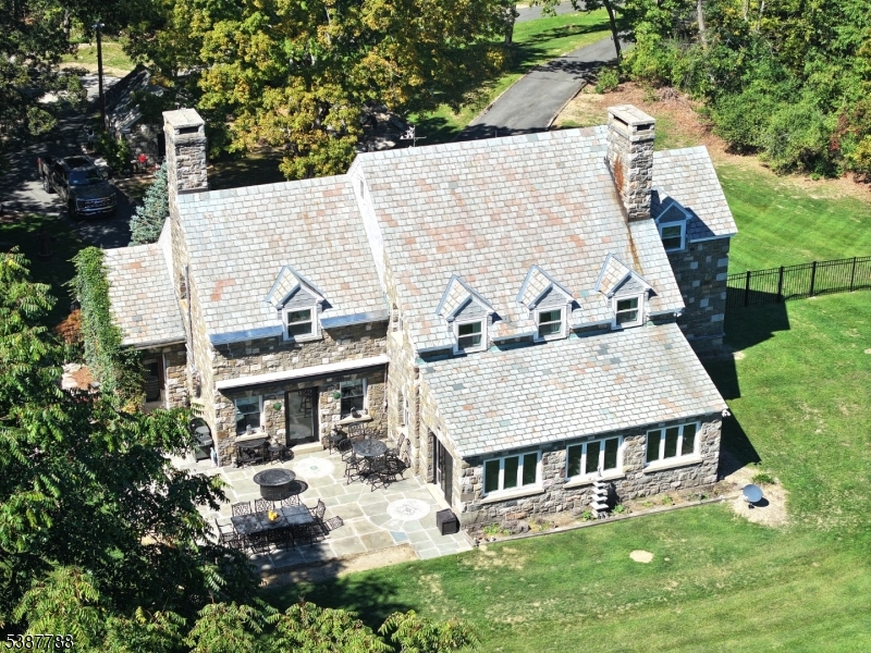 a view of a house with yard and sitting area