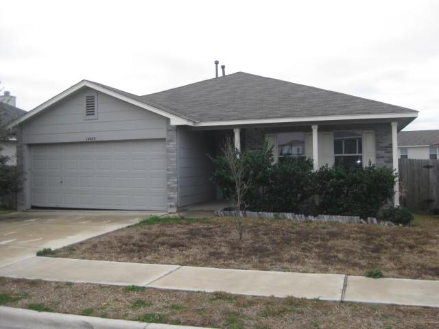 a front view of house with garage and yard