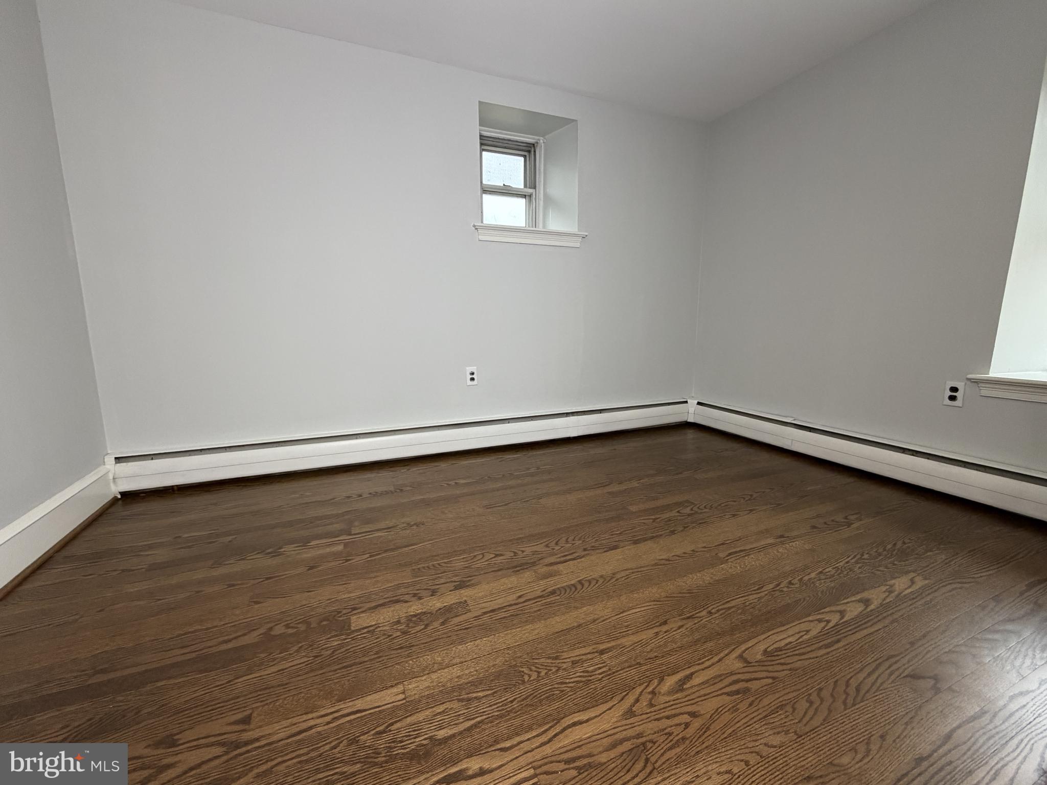 4700 Thompsons Bridge Road Wilmington, DE 19803 - Photo 40 of 41 a view of an empty room with wooden floor and a window