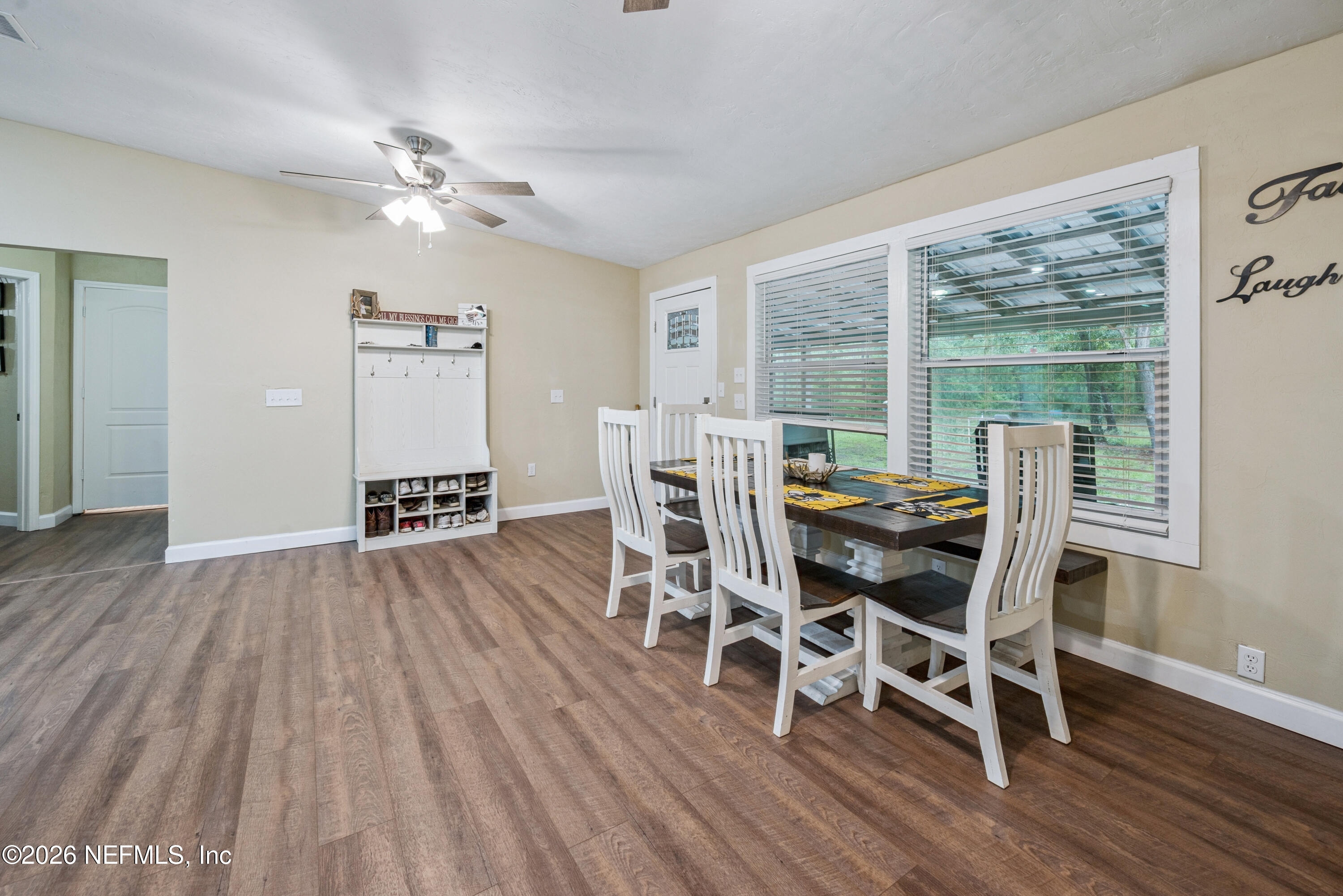 11309 Southwest 167th Circle Brooker, FL 32622 - Photo 11 of 42 a view of a dining room with furniture window and wooden floor