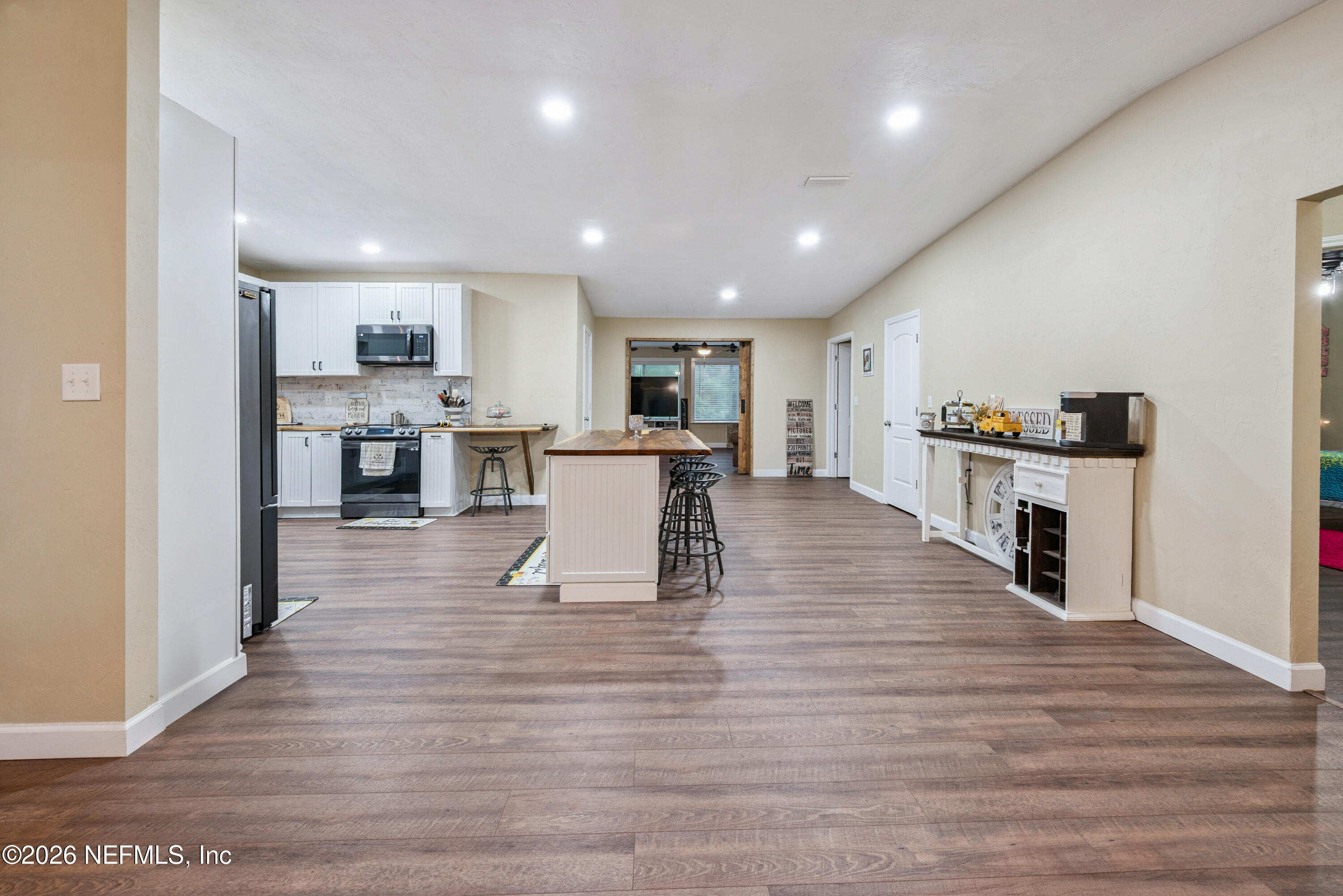 11309 Southwest 167th Circle Brooker, FL 32622 - Photo 14 of 42 a view of kitchen dining table chairs and wooden floor