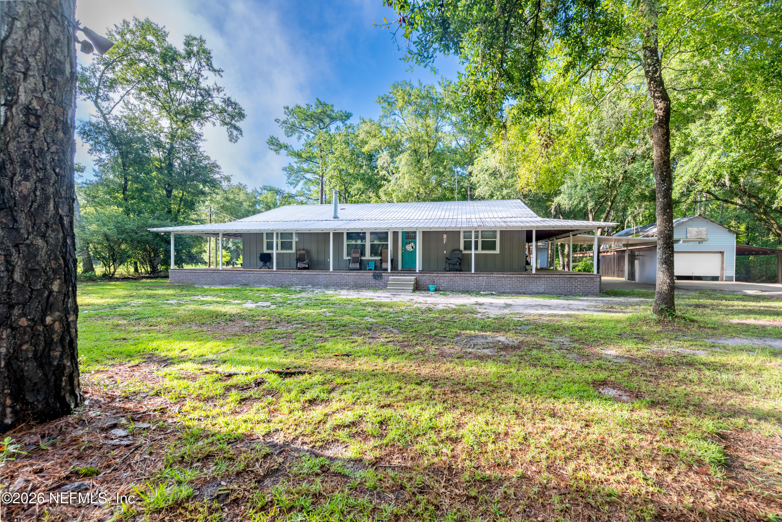 11309 Southwest 167th Circle Brooker, FL 32622 - Photo 2 of 42 a view of a house with a yard balcony and swimming pool