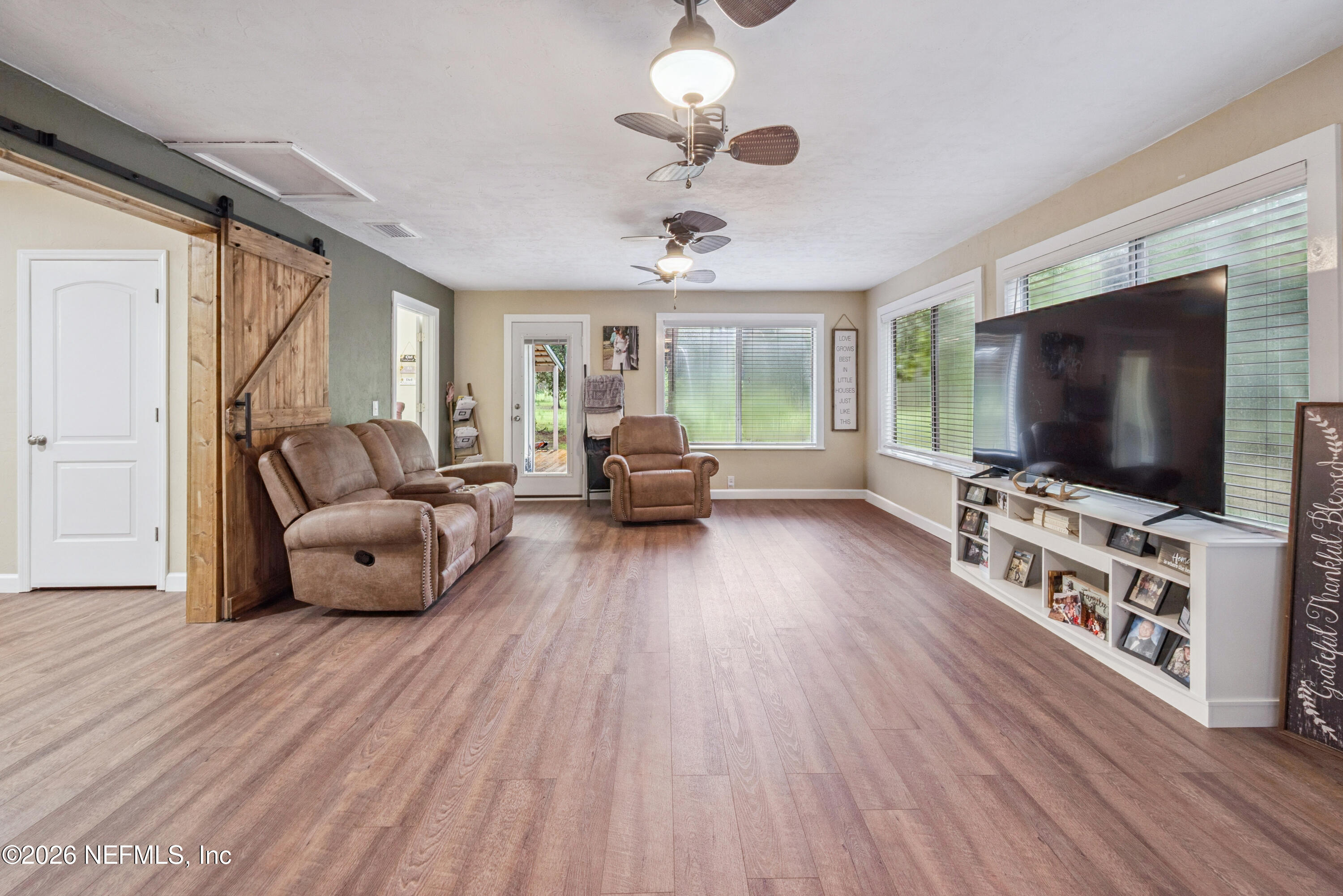 11309 Southwest 167th Circle Brooker, FL 32622 - Photo 24 of 42 a living room with furniture and a flat screen tv