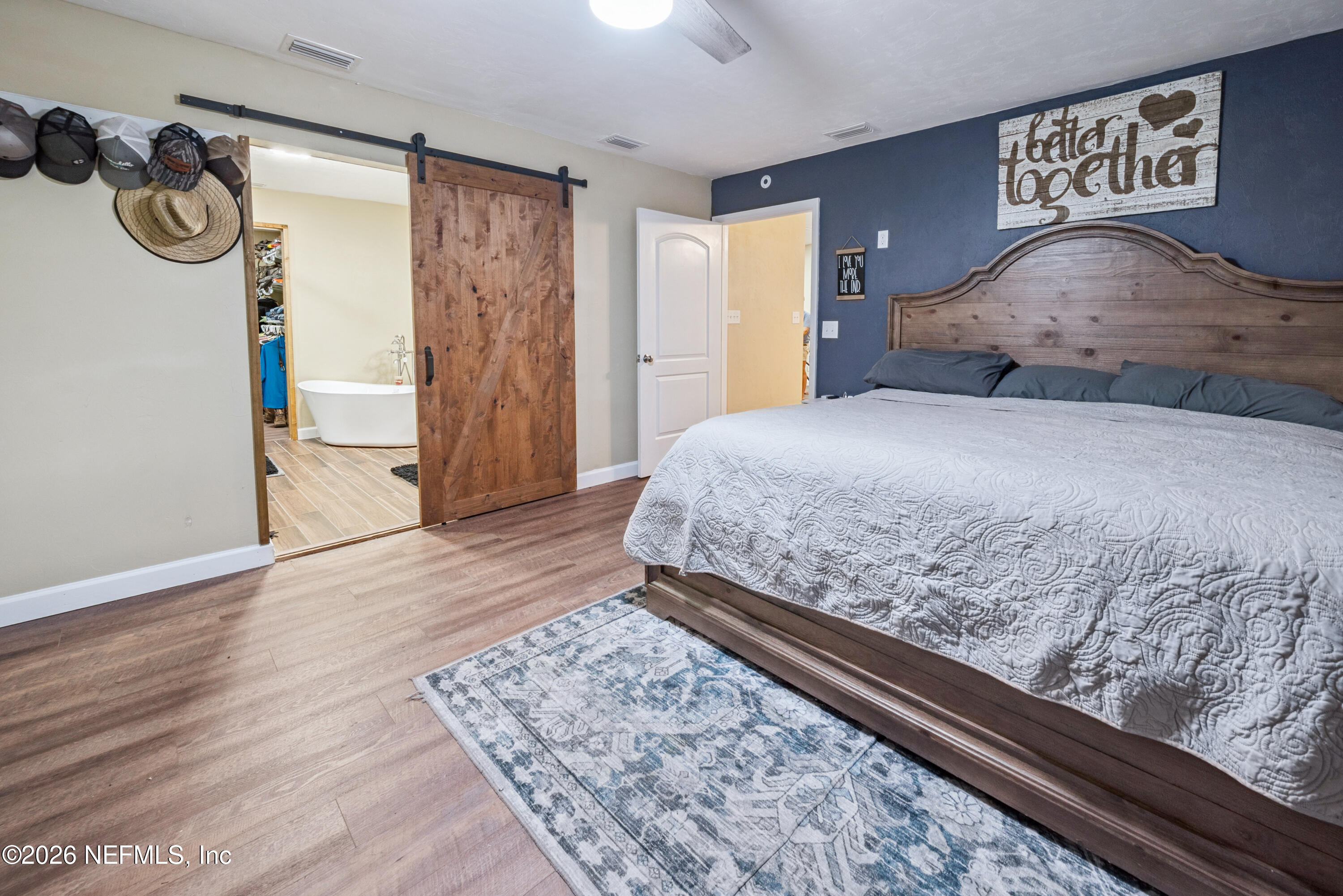 11309 Southwest 167th Circle Brooker, FL 32622 - Photo 28 of 42 a bedroom with a bed and a dresser