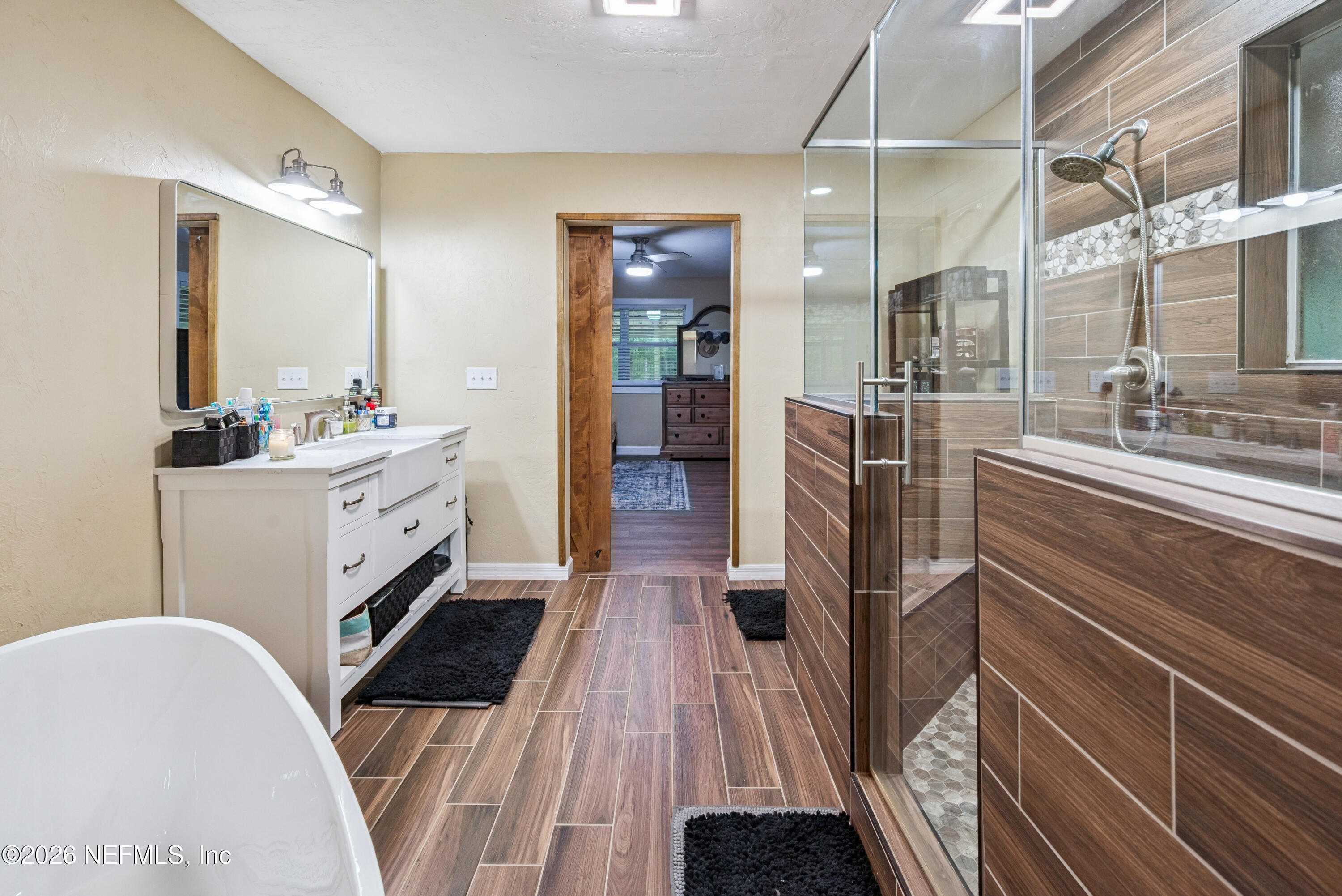 11309 Southwest 167th Circle Brooker, FL 32622 - Photo 31 of 42 a bathroom with a sink a toilet and mirror