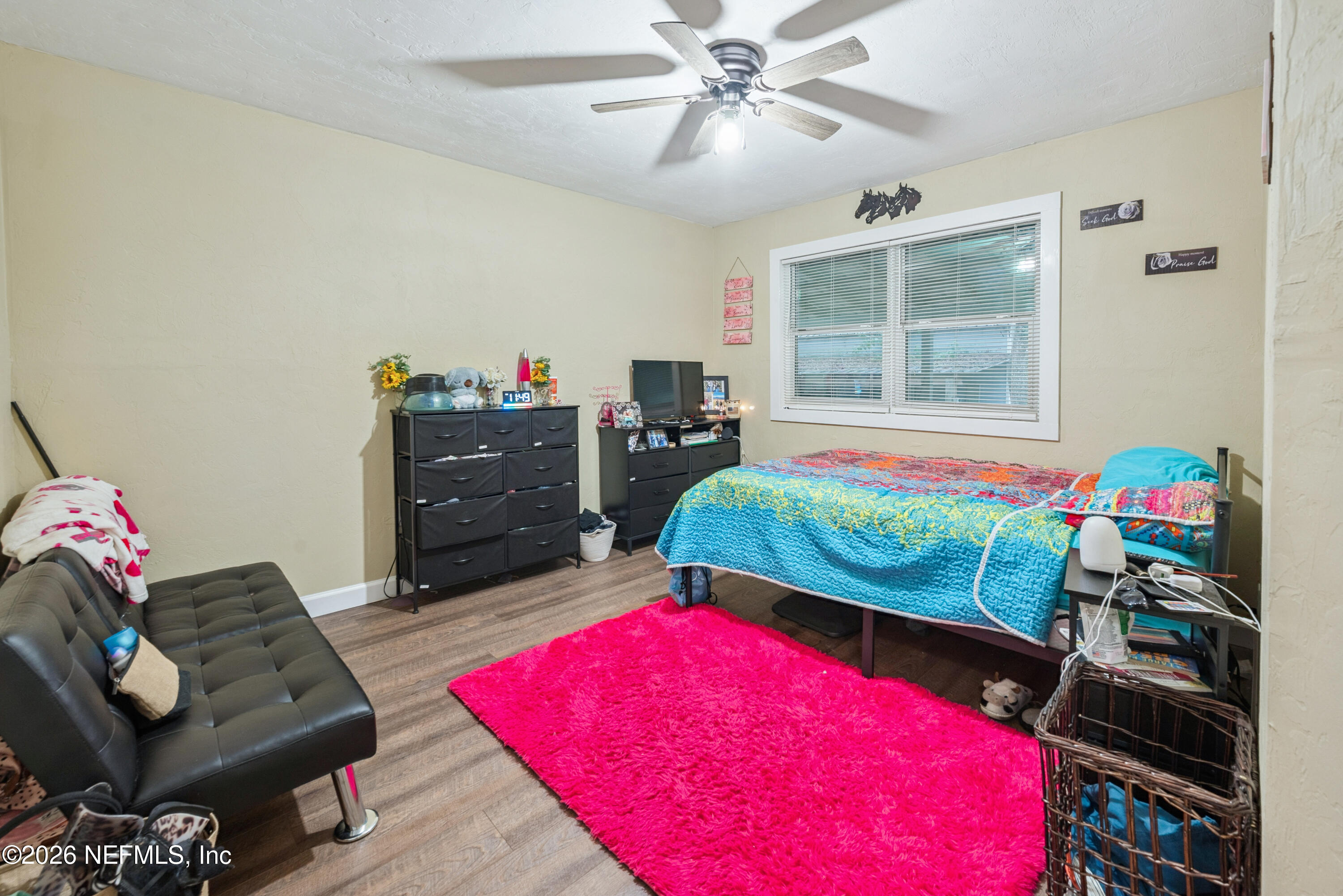 11309 Southwest 167th Circle Brooker, FL 32622 - Photo 36 of 42 a bedroom with a bed and a couch