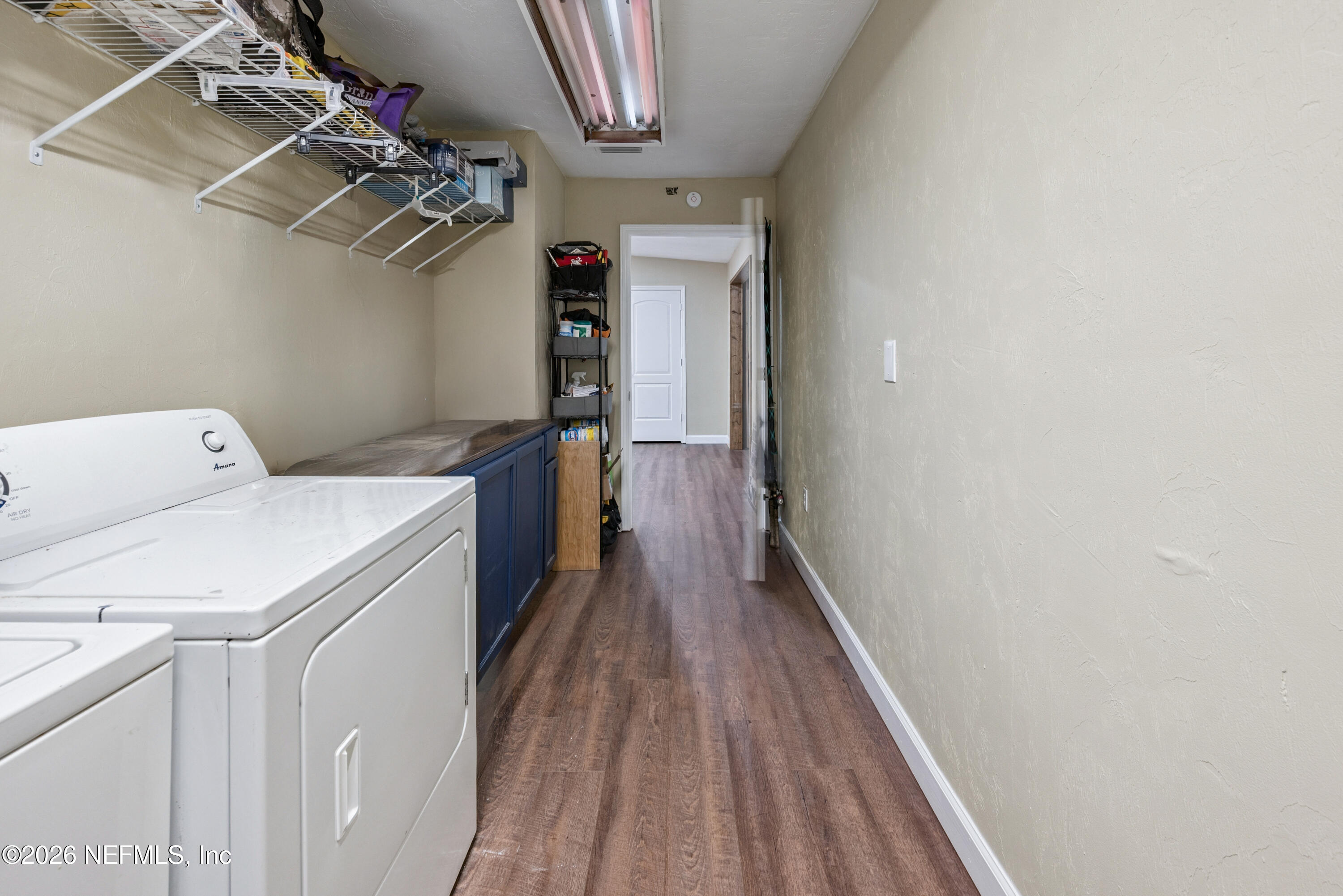 11309 Southwest 167th Circle Brooker, FL 32622 - Photo 41 of 42 a storage room with wooden floor