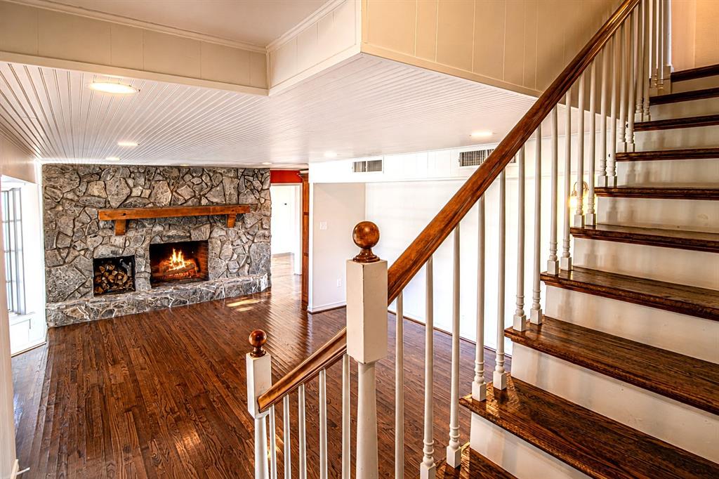 9310 Merritt Road Rowlett, TX 75089 - Photo 9 of 40 a view of an entryway with wooden floor and stairs